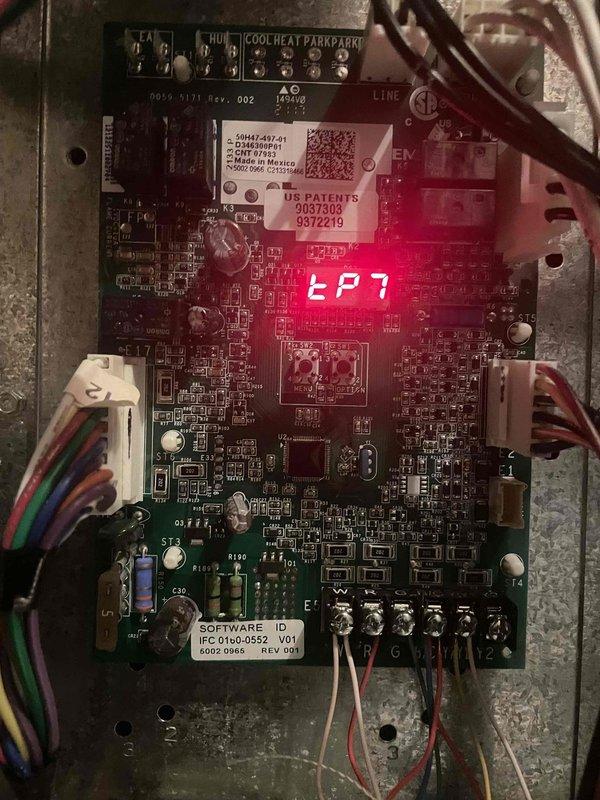 Completed cooling maintenance club visit on air handler system. Inspected and documented control board operation showing EP7 display code, verified all electrical connections and wiring harnesses secure at terminal strip and circuit board connections. Documented condition of air handler unit installed above bathroom space, noting foil-faced insulation intact with normal dust accumulation on ductwork surfaces.