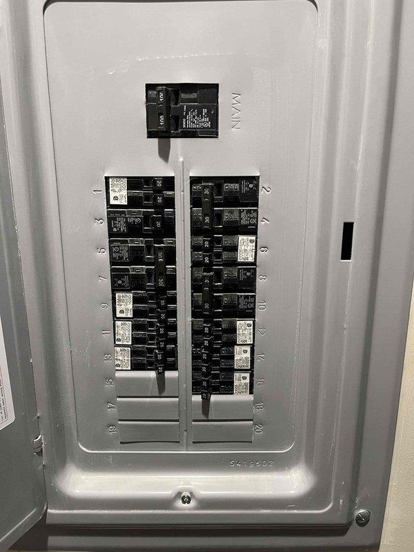 Responded to emergency service call for air conditioning system blowing warm air with unknown system age. Performed comprehensive system evaluation including inspection of attic-mounted air handling unit and electrical service panel. Documented existing equipment configuration showing horizontal air handler installation with PVC condensate drainage system, flexible ductwork connections, and electrical conduit routing. Assessed electrical panel showing proper circuit breaker arrangement and main disconnect capabilities. Based on system condition and operational failure, provided estimate for complete HVAC system replacement. Photographed existing equipment and electrical infrastructure to support replacement recommendations and ensure proper sizing for new equipment installation.