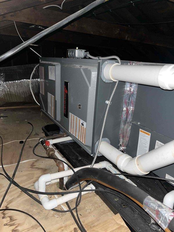 Responded to emergency service call for air conditioning system blowing warm air with unknown system age. Performed comprehensive system evaluation including inspection of attic-mounted air handling unit and electrical service panel. Documented existing equipment configuration showing horizontal air handler installation with PVC condensate drainage system, flexible ductwork connections, and electrical conduit routing. Assessed electrical panel showing proper circuit breaker arrangement and main disconnect capabilities. Based on system condition and operational failure, provided estimate for complete HVAC system replacement. Photographed existing equipment and electrical infrastructure to support replacement recommendations and ensure proper sizing for new equipment installation.