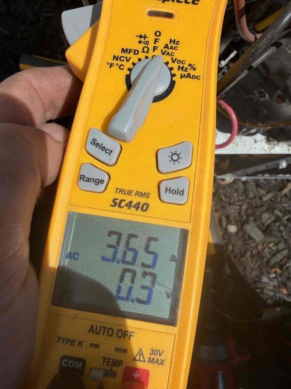 Completed comprehensive air conditioning tune-up service on residential system. Performed electrical diagnostics using digital multimeter to verify proper voltage and amperage readings at the outdoor condensing unit. Inspected exterior disconnect box and electrical connections, confirming secure mounting and proper conduit installation. System operating within normal parameters with no deficiencies identified during inspection.