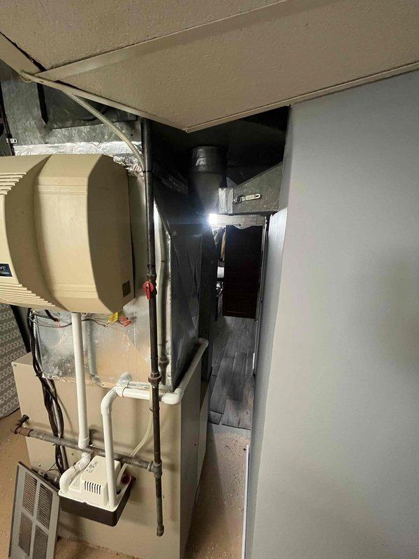 Performed comprehensive assessment of existing HVAC system experiencing refrigerant leak and mechanical rattling as reported by previous contractor. Evaluated outdoor condensing unit and indoor air handler to determine system condition and provided complete replacement options for both components. Documented current equipment installation in side yard location and basement-mounted air handler configuration to prepare accurate replacement proposal.