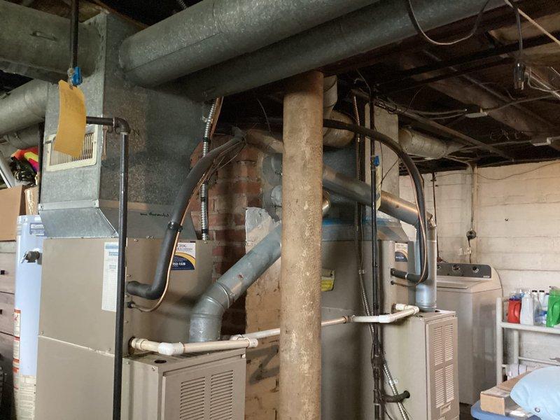 Conducted on-site evaluation of aging air conditioning system located in basement mechanical room for replacement estimate. Assessed existing HVAC equipment, ductwork configuration, and installation access requirements. Documented current system conditions and spatial constraints to provide accurate equipment replacement recommendations.