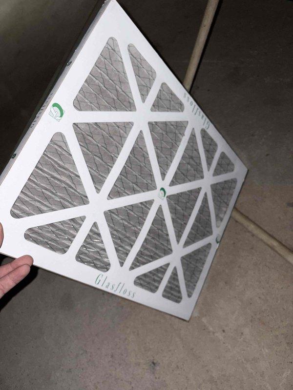 Responded to no cooling call on 10+ year old HVAC system. Inspected air handler and found severely restricted airflow due to missing or improperly installed air filter. Installed new 16x20x1 Glasfloss pleated air filter with proper fit and seal in filter rack. System airflow restored to normal operation and cooling function verified.