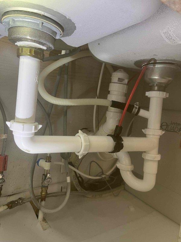 Responded to recurring kitchen sink backup issue. Assessed double-bowl sink plumbing system with P-trap configuration and determined garbage disposal was contributing to ongoing drainage problems. Removed garbage disposal unit per customer request to resolve chronic blockage issues. Verified proper drainage flow through modified drain assembly and confirmed all connections were secure with no leaks present.