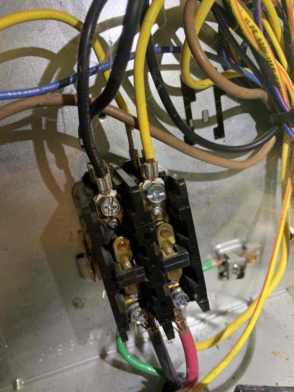 Responded to no cooling call on system installed in October that may not have been properly started up. Upon arrival, performed electrical diagnostics using multimeter to measure amperage draw at contactor, which read 0.58A. Inspected contactor assembly and verified proper wire connections across all terminals including control and line voltage circuits. System required initial startup procedures to restore cooling operation.