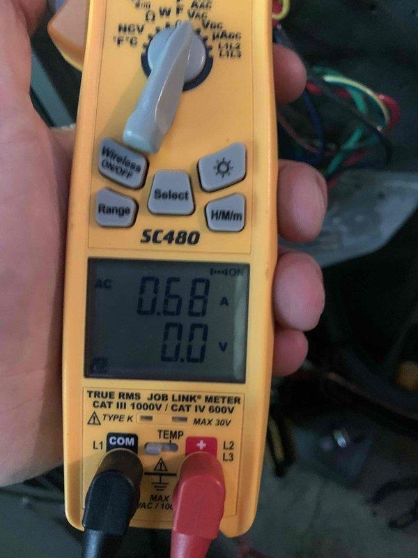 Responded to no cooling call on system installed in October that may not have been properly started up. Upon arrival, performed electrical diagnostics using multimeter to measure amperage draw at contactor, which read 0.58A. Inspected contactor assembly and verified proper wire connections across all terminals including control and line voltage circuits. System required initial startup procedures to restore cooling operation.