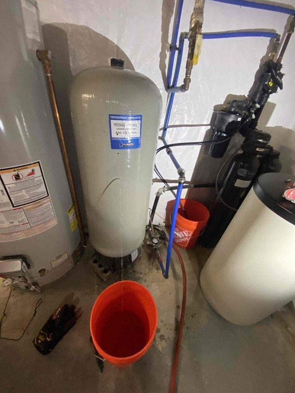 Installed new FL12 pressure tank in mechanical room to replace failed unit. Connected tank to existing plumbing system using blue PEX tubing and appropriate fittings, ensuring proper integration with water heater and expansion tank. Tested system pressure and verified proper operation of all components upon completion.