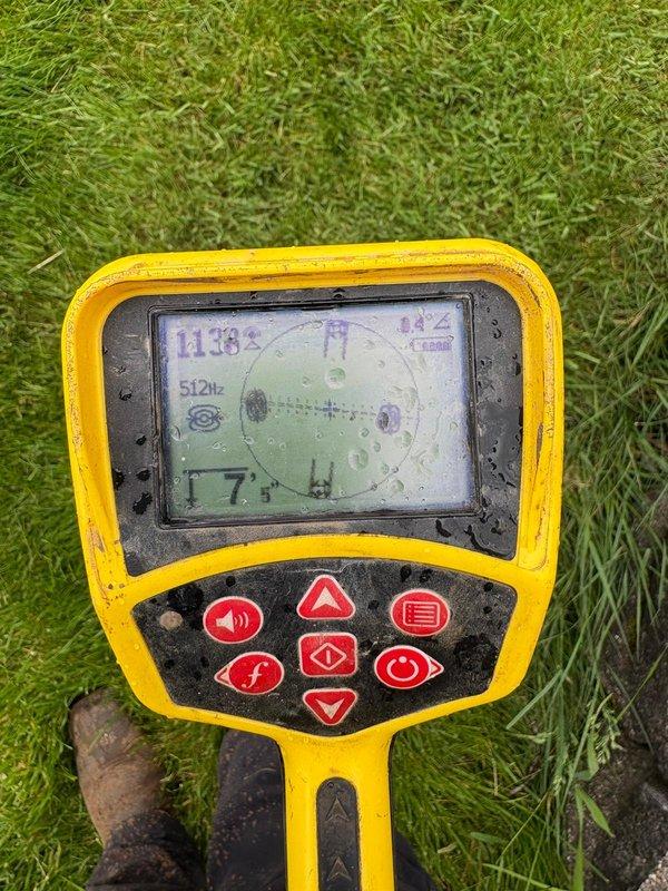 Responded to basement water backup concern and performed camera inspection of underground drainage system. Used electronic locating equipment to trace and identify subsurface plumbing lines, then accessed pit to visually inspect interior conditions, documenting standing water, multiple pipe connections, and drainage components for insurance claim documentation.