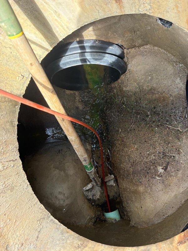 Responded to basement water backup concern and performed camera inspection of underground drainage system. Used electronic locating equipment to trace and identify subsurface plumbing lines, then accessed pit to visually inspect interior conditions, documenting standing water, multiple pipe connections, and drainage components for insurance claim documentation.