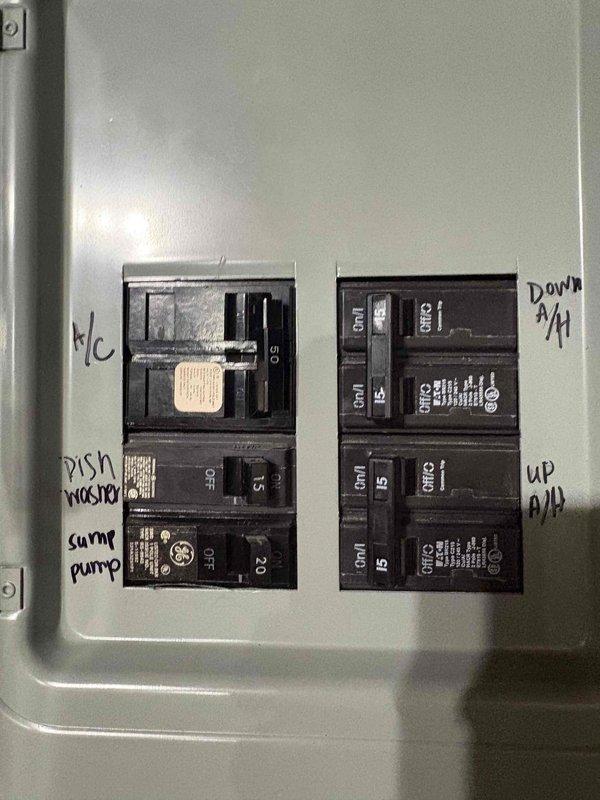 Completed estimate for replacement of 36-year-old air conditioning system serving dual-zone residential application with single outdoor condenser unit supplying both upstairs and downstairs air handlers. Documented existing electrical panel configuration showing dedicated circuits for both air handler units. Provided replacement options and recommendations for upgrading aging HVAC system to improve efficiency and reliability.