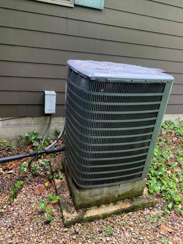 Completed routine cooling maintenance member visit on residential air handling system. Performed standard diagnostic testing using digital multimeter, recording temperature readings of 97.9°F at the outdoor condensing unit. Inspected exterior equipment showing normal weathering, verified electrical connections at disconnect box, and confirmed unit operational status per maintenance agreement specifications.