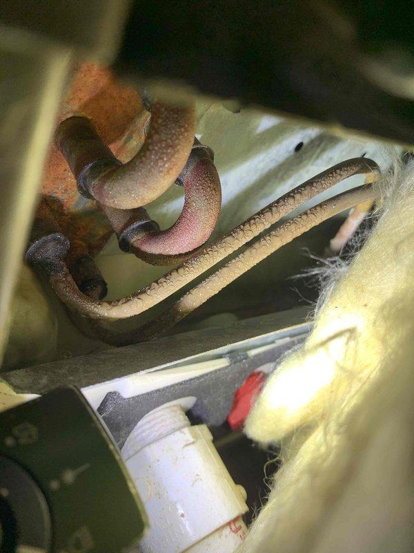 Completed annual AC tune-up on 15-year-old air conditioning system as part of club membership maintenance visit. Performed comprehensive inspection including temperature differential measurements, which showed unit operating at 44.12°F at the evaporator coil. Noted significant rust and corrosion present on refrigerant lines and coil components, though system is currently functioning properly. Documented existing condition with photos for future reference and recommended monitoring corrosion progression during subsequent maintenance visits.