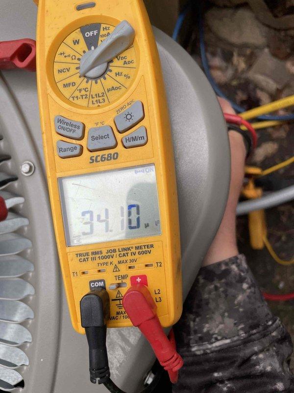 Completed routine cooling maintenance member visit on HVAC system. Inspected and verified clean pleated air filter condition within air handling unit, checked electrical connections and wiring integrity, and performed diagnostic voltage measurements reading 34.0V using calibrated multimeter to ensure proper system operation and performance.