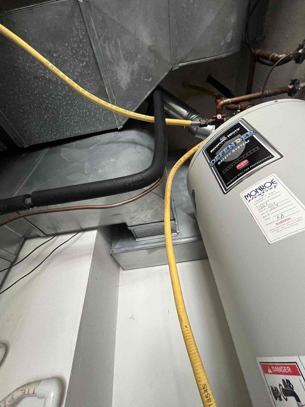 Conducted comprehensive HVAC replacement estimate for a 22-year-old air conditioning system that is currently non-operational. Assessed existing equipment configuration in mechanical room, including air handler unit and associated ductwork showing moisture accumulation. Documented equipment clearances and measured vertical space constraints in utility area to determine replacement unit specifications and installation requirements for new HVAC system.