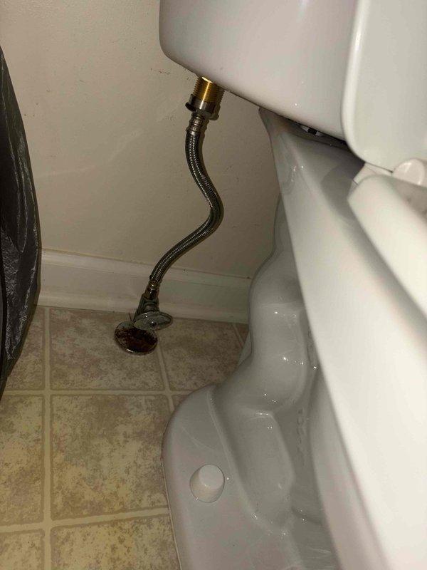 Responded to callback for leaking faucet issue. Upon arrival, inspected bathroom plumbing fixtures and water supply connections. Verified toilet water supply line installation with braided flex hose and shut-off valve connections were properly secured and functioning without leaks. Documented plumbing system configuration including wall-mounted tank connections and floor-mounted shut-off valve. All water supply lines and connections tested and confirmed operational.