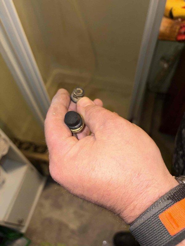 Responded to shower faucet leak in residential bathroom. Disassembled shower valve assembly and replaced worn internal components including cartridge seals and spring mechanisms. Tested operation and verified leak was eliminated with no further dripping from faucet.