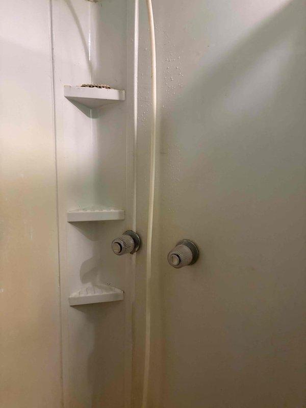 Responded to shower faucet leak in residential bathroom. Disassembled shower valve assembly and replaced worn internal components including cartridge seals and spring mechanisms. Tested operation and verified leak was eliminated with no further dripping from faucet.