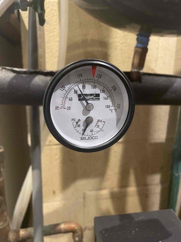 Completed comprehensive boiler maintenance inspection including visual assessment of hydronic piping manifold system, zone valves, and circulation components. Verified proper pressure and temperature readings on system gauges, inspected copper distribution lines and fittings for leaks or corrosion, and documented equipment condition with photographic records for member files.