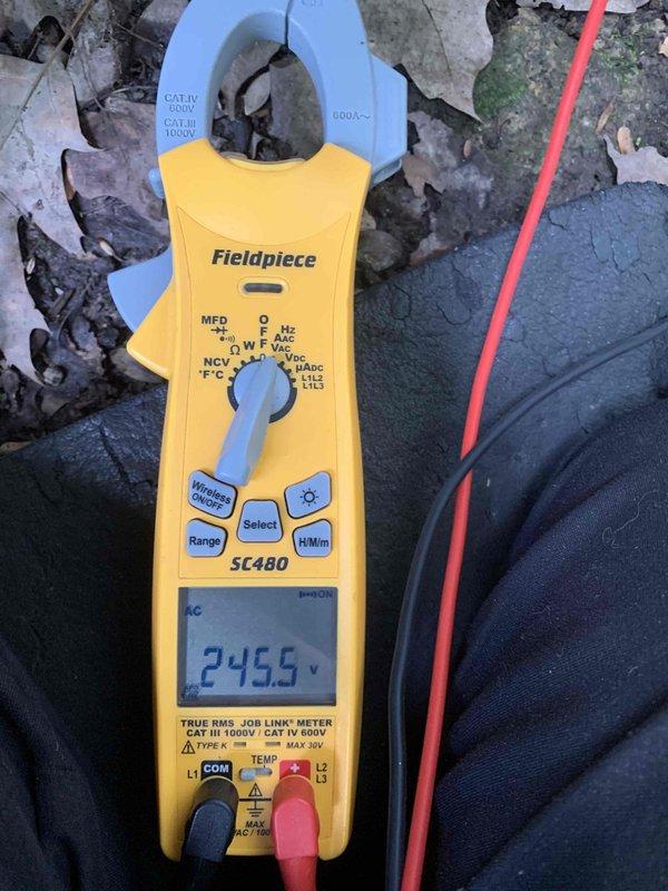Completed cooling maintenance on three air handling units as part of preventative maintenance membership service. Inspected equipment accessibility in crawlspace area, performed electrical diagnostics with clamp meter showing system voltage readings, and documented conditions of mechanical components and surrounding installation areas. Removed accumulated debris from equipment vicinity to ensure proper airflow and system operation.