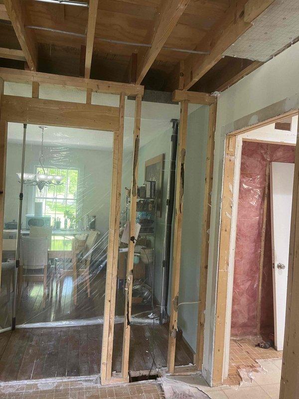 Installed new return air ductwork routing from the main HVAC system to the back door area of the garage. Work included framing modifications, proper insulation installation with foil-faced and rigid foam board materials, and securing all ductwork components with appropriate metal brackets and hangers to ensure efficient airflow and system performance.