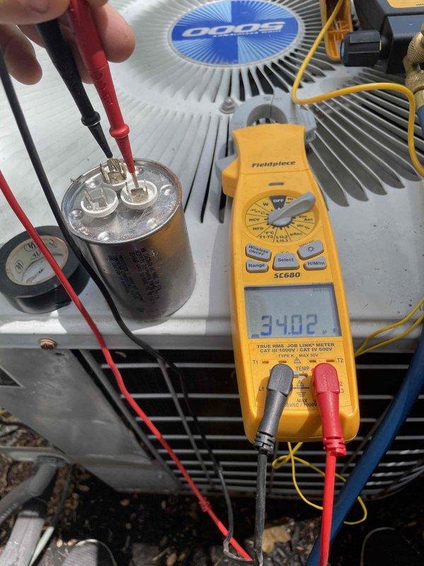 Completed cooling maintenance on air handler unit as part of preventative maintenance program. Performed comprehensive electrical diagnostics including capacitor testing, which measured 3402 microfarads using calibrated digital multimeter to verify proper component operation. Inspected blower motor assembly, control board, gas valve connections, and all associated wiring for signs of wear or damage. Verified all electrical connections were secure, checked condensate drainage system, and confirmed proper airflow through the unit. All components found operating within manufacturer specifications with no deficiencies noted at time of inspection.