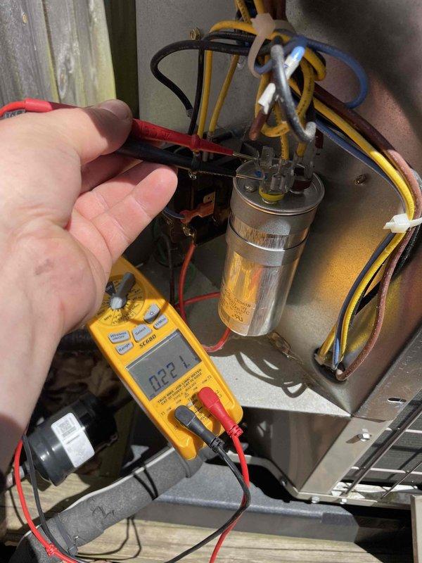 Responded to no cooling call at residential property. Upon arrival, performed diagnostic testing of HVAC system using digital multimeter to check electrical components and capacitor readings. Measured capacitance values and verified electrical connections at the outdoor condensing unit. System evaluated and tenant coordinated for follow-up service appointment to complete necessary repairs.