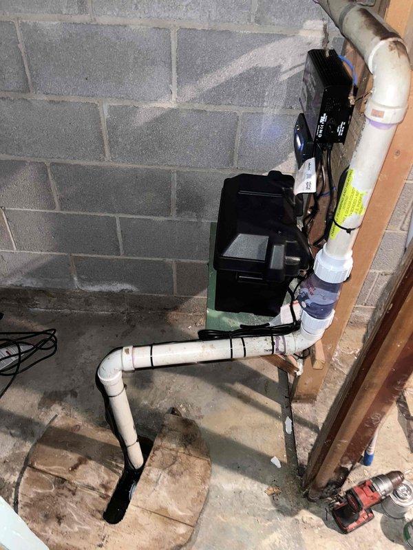 Completed installation of backup sump pump system with check valve and PVC discharge piping in basement utility area. Replaced outdoor spigot and serviced two running toilets to restore proper operation and eliminate water waste.