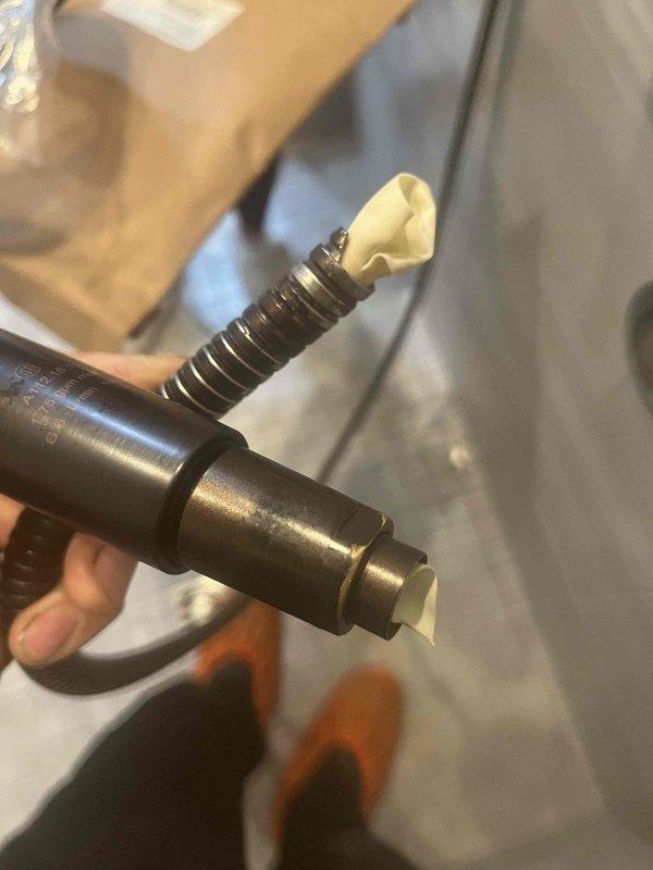 Responded to service call for detached shower head tubing. Upon inspection, found the handheld shower hose had separated from the mounting connection point on the slide bar assembly. Reattached and secured the flexible hose connection to the bronze finish slide bar system, ensuring proper threading and seal integrity. Tested water flow through both the overhead shower head and handheld unit to verify no leaks at connection points and confirm full functionality of the dual shower system.