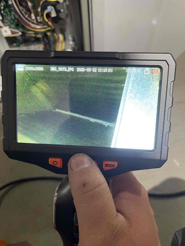 Completed cooling maintenance club visit on air handler system. Performed internal ductwork inspection using digital borescope camera to assess interior conditions and verify system integrity. Inspected outdoor utility disconnect box and service valves with proper identification labeling in place.