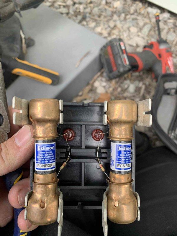 Completed cooling maintenance club visit on air handler system. Performed comprehensive inspection of outdoor condenser unit, examining underside components, refrigerant lines, and condensate drain system. All PVC drain lines verified clear and functioning properly. Inspected and tested dual-fuse electrical assembly with ECNR30 fuses, confirming proper amperage rating and secure connections. All electrical components operating within specifications with no signs of overheating or deterioration. Unit operational and ready for continued service.