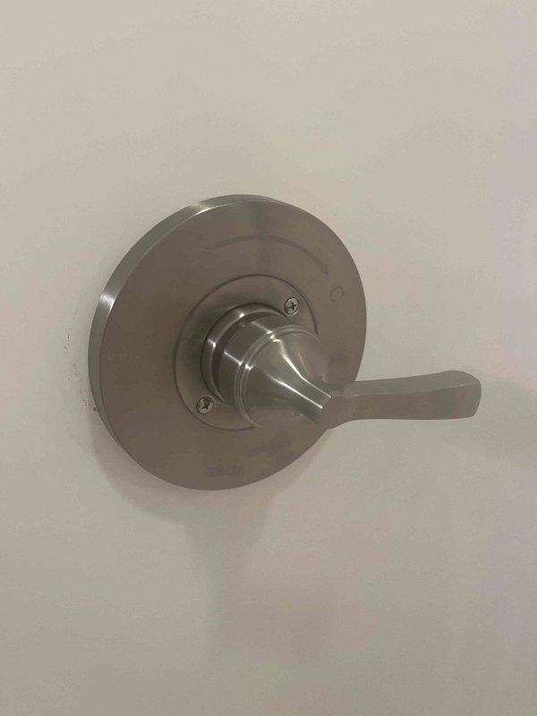 Responded to water leak complaint originating from shower fixture causing damage to basement below. Upon inspection, identified failed shower valve assembly as source of leak. Removed existing chrome shower valve and trim, then installed customer-provided replacement fixture. Tested new installation for proper operation and verified complete seal with no active leaks detected. Confirmed water flow to basement had been eliminated.
