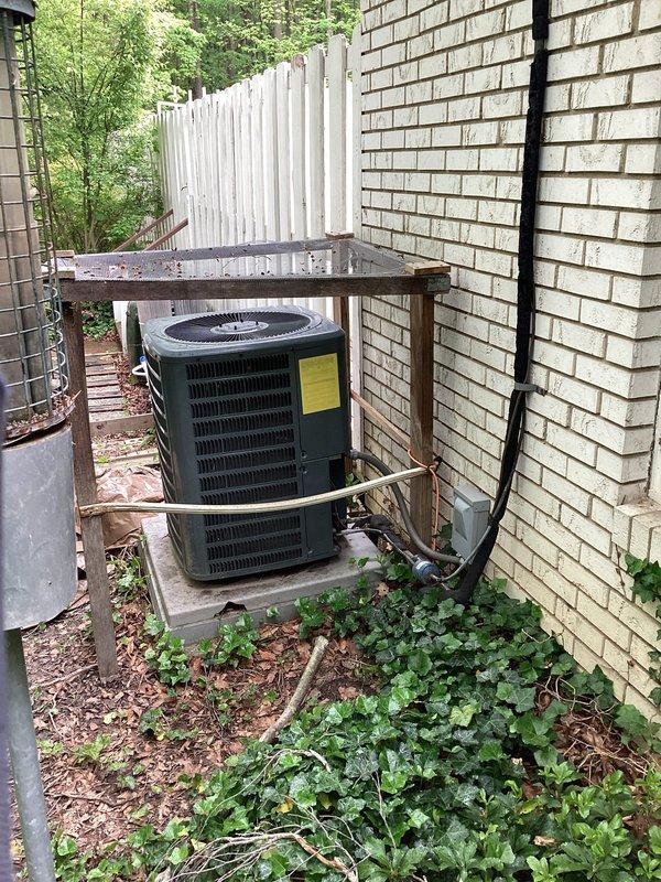 Completed HVAC estimate for air handler replacement at residential property. Evaluated existing outdoor condensing unit and indoor air handler system, documented current equipment condition and thermostat wiring configuration. Assessed installation accessibility in exterior corner location with overhead shelter structure and reviewed electrical disconnect and refrigerant line routing. Provided comprehensive replacement options and specifications for new air handler system to address customer's heating and cooling needs.