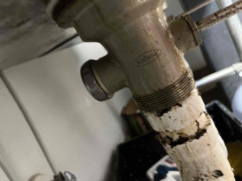 Responded to clogged drain call at hand washing station. Upon inspection, found blockage in drain assembly beneath sink. Cleared obstruction from P-trap and drain line, restoring proper water flow and drainage. Verified all connections were secure and tested system to ensure complete functionality.