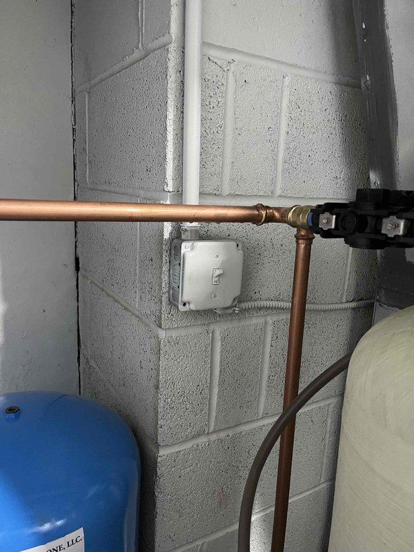 Responded to water leak in utility room with multiple connection failures at copper piping network servicing GE SmartWater treatment system. Upon inspection, identified several compromised joints and fittings in the copper pipe configuration above and around the water treatment unit. Repaired leaking connections, replaced deteriorated pipe sections as needed, and verified system integrity. All connections tested and confirmed leak-free upon completion.