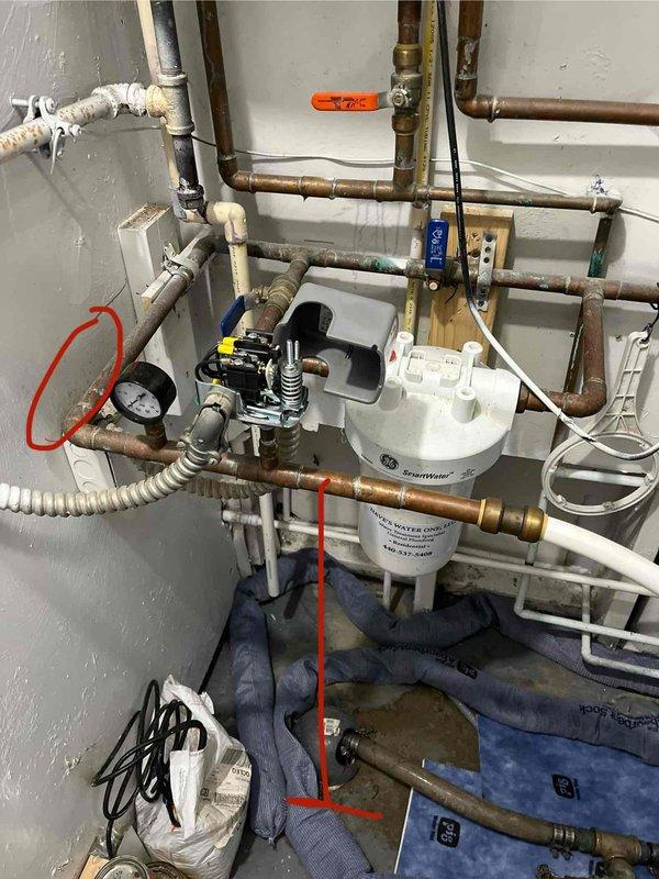 Responded to water leak in utility room with multiple connection failures at copper piping network servicing GE SmartWater treatment system. Upon inspection, identified several compromised joints and fittings in the copper pipe configuration above and around the water treatment unit. Repaired leaking connections, replaced deteriorated pipe sections as needed, and verified system integrity. All connections tested and confirmed leak-free upon completion.