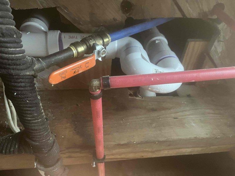Responded to callback for recurring toilet drainage issue. Upon inspection, discovered significant blockage in drain line with accumulated debris and sediment buildup. Removed obstruction material from plumbing system and performed soldering work on brass fittings and connections beneath fixture to address underlying drainage problem. Cleared drain line and verified proper flow restoration.