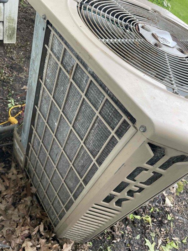 Responded to no cooling call on York air conditioning unit over 10 years old. Upon arrival, connected manifold gauges to assess system pressures and found unit not operating efficiently. Inspected outdoor condenser unit and observed heavily soiled condenser coil with significant accumulation of dirt, dust, and debris restricting airflow through the fins. Performed thorough cleaning and maintenance of the condenser coil to restore proper heat transfer and system operation.