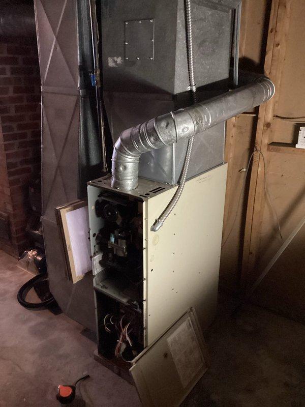 Conducted comprehensive HVAC replacement estimate for residential property with two existing systems: one 30-year-old unit and one 25-year-old unit, both currently operational with air conditioning. Assessed basement installation area with exposed furnace units, ductwork configurations, and utility connections. Primary focus on definite replacement of older system, with secondary evaluation of 25-year-old unit for potential future replacement based on efficiency analysis and customer needs.
