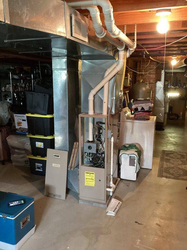 Conducted comprehensive HVAC replacement estimate for residential property with two existing systems: one 30-year-old unit and one 25-year-old unit, both currently operational with air conditioning. Assessed basement installation area with exposed furnace units, ductwork configurations, and utility connections. Primary focus on definite replacement of older system, with secondary evaluation of 25-year-old unit for potential future replacement based on efficiency analysis and customer needs.