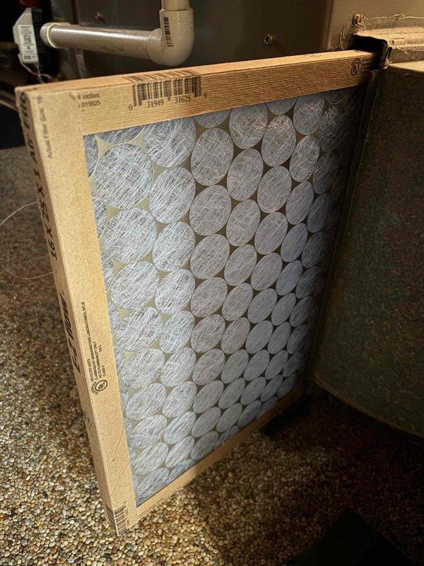 # HVAC No Cool Service Call

Responded to a no cooling complaint on a 15-year-old air conditioning system. Upon arrival, performed diagnostic testing of the unit to identify the cause of the cooling failure. Inspected the air handler and found the air filter required replacement. Installed a new pleated HVAC filter with honeycomb media to restore proper airflow through the system. 

Conducted electrical diagnostics using a digital multimeter to verify proper voltage and system operation. Measured AC voltage readings at key components to ensure the system was receiving adequate power supply. All electrical measurements were within acceptable parameters.

System restored to normal cooling operation. Verified proper airflow and electrical function before completing the service call.