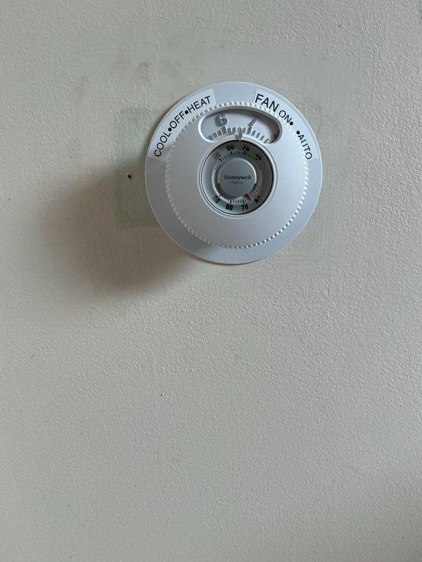 Returned to property to complete installation of Honeywell round mechanical thermostat. Verified proper wire terminations for heating, cooling, and fan control circuits. Tested system operation across all modes (Cool, Off, Heat, Fan On, Auto) to confirm proper functionality and communication with HVAC equipment.