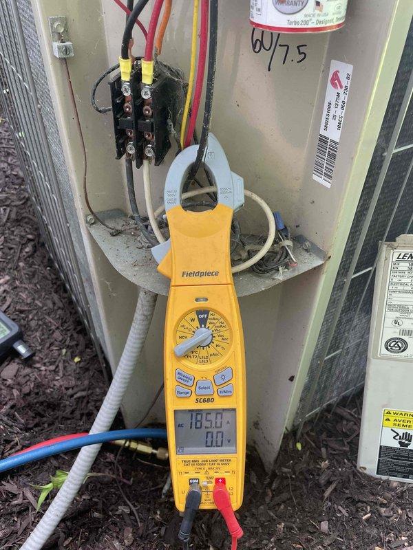 Completed cooling maintenance for club member on air handler system. Performed electrical diagnostics using clamp meter, recording amperage draw of 18.9 amps at the outdoor unit disconnect panel. Conducted refrigerant system analysis with digital manifold gauges, documenting system pressures and temperatures to verify proper refrigerant charge and system operation. All measurements fell within manufacturer specifications for the Lennox unit. System operating normally with no deficiencies noted.