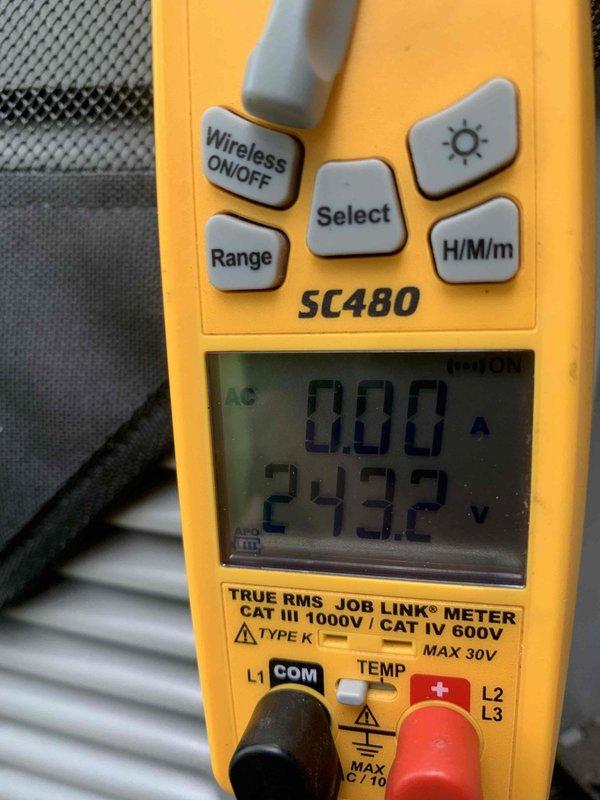 Responded to service call for loud noise from furnace when air conditioning system operates. Performed system inspection and AC tune-up on air handler unit. Inspected and documented condition of air filtration system, noting dust accumulation on pleated filters. Verified electrical parameters using digital multimeter, measuring 243.2 volts AC supply to unit with proper voltage readings. Checked amperage draw showing 0.00A at time of measurement. Completed preventive maintenance procedures on air handler equipment and documented system conditions with photographs for service records.