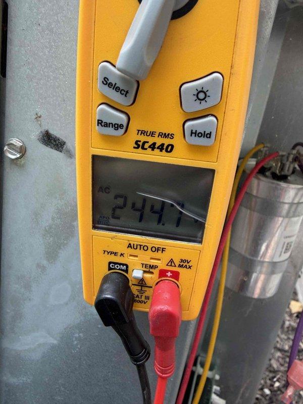 Responded to service call for air conditioning system not maintaining temperature, with indoor temperature reaching 82°F despite continuous operation. Performed diagnostic testing using digital multimeter to check electrical components and verify proper voltage readings at capacitor and control board connections. Measured 244V AC at system components to confirm power supply integrity. Inspected and tested Emerson Climate Technologies control module and associated circuit boards for proper operation. Completed preventative maintenance service including electrical system verification and control board inspection to ensure optimal system performance.
