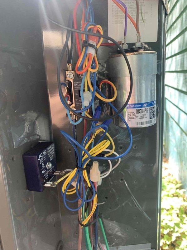 Completed preventive maintenance tune-up on a 2-year-old residential air conditioning system. Performed comprehensive inspection of outdoor condenser unit, verified proper operation of capacitor and contactor within electrical control panel, checked all wire connections and electrical components for secure termination and proper condition. System found operating within normal parameters with no deficiencies noted.