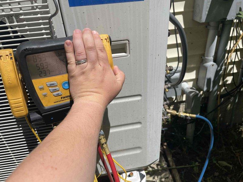 Responded to service call for a 4-year-old 36,000 BTU four-zone mini split system displaying low system pressure fault code on wall unit. Upon arrival, utilized digital refrigerant meter to diagnose system pressures and temperatures. Confirmed low refrigerant charge through pressure readings and superheat/subcooling measurements. System evaluated for potential leak sources and operational parameters documented for further repair recommendations.