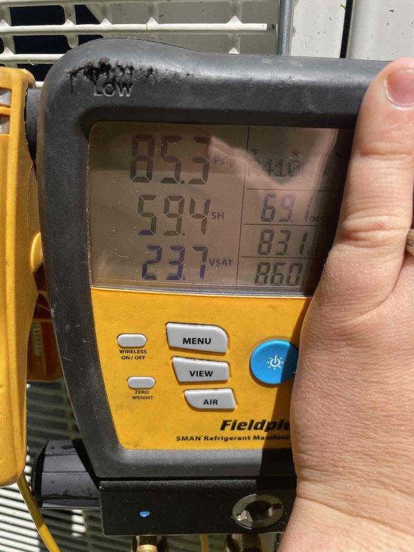 Responded to service call for a 4-year-old 36,000 BTU four-zone mini split system displaying low system pressure fault code on wall unit. Upon arrival, utilized digital refrigerant meter to diagnose system pressures and temperatures. Confirmed low refrigerant charge through pressure readings and superheat/subcooling measurements. System evaluated for potential leak sources and operational parameters documented for further repair recommendations.