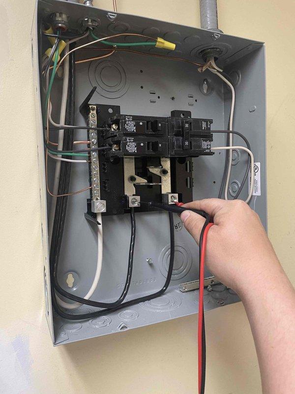Responded to callback for recently installed AC system not cooling. Upon arrival, discovered circuit breaker tripped at electrical panel. Reset breaker, verified system power restored, and confirmed unit operation. System now functioning properly and cooling effectively.