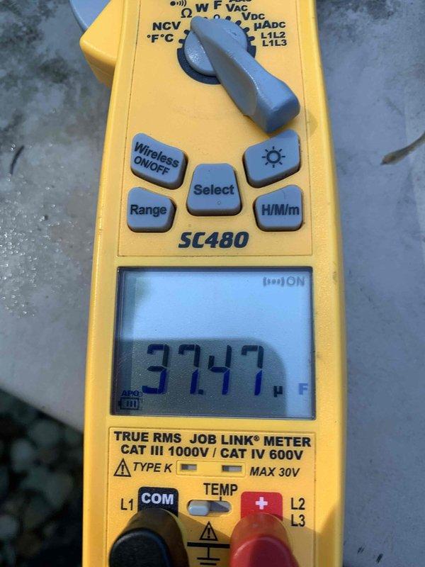 Performed comprehensive air conditioning tune-up on 12-year-old residential system. Upon inspection, discovered severely corroded dual run capacitor in outdoor condensing unit requiring immediate replacement due to extensive rust damage compromising electrical connections and component integrity. Replaced failed capacitor with new unit, verified proper microfarad readings with digital multimeter showing 37.47 µF, cleaned electrical compartment of debris, tested all electrical connections at terminal block, and confirmed system operational parameters within manufacturer specifications for safe seasonal operation.