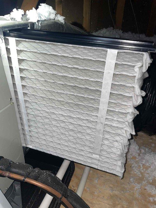 Completed HVAC club membership renewal and maintenance inspection. During evaluation of outdoor condensing unit, identified exposed electrical wiring at air handler requiring attention for safety compliance. Documented equipment condition including refrigerant line connections, service ports, and outdoor unit installation. Interior inspection revealed air handler with significant frost accumulation on evaporator coil and surrounding components, indicating potential airflow restriction, refrigerant charge issue, or system malfunction. Filter showed signs of stress and deformation. Captured photographic documentation of exposed wiring hazard and abnormal frost buildup for customer records and future service reference.